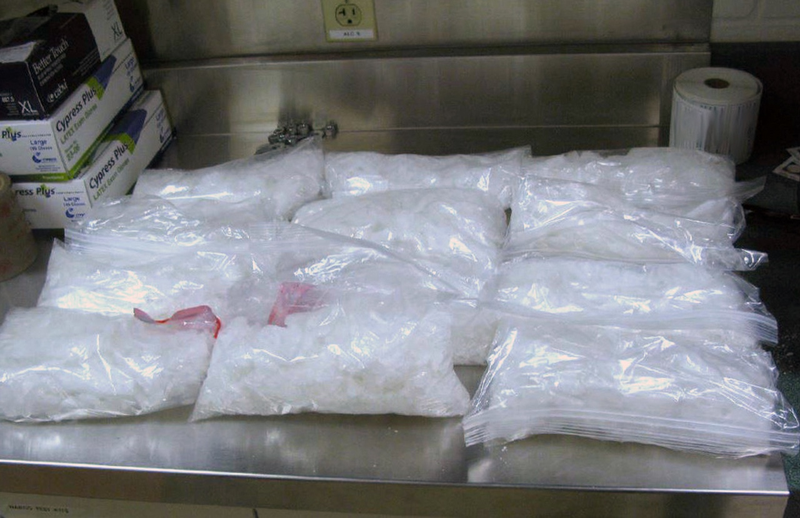 This undated photo provided by US Customs and Border Protection shows 12 packages of methamphetamine that were confiscated from a US citizen after a border patrol agent spotted a remote-controlled drone swooping over the border fence August 8, 2017 at a border crossing near San Diego (via AP)